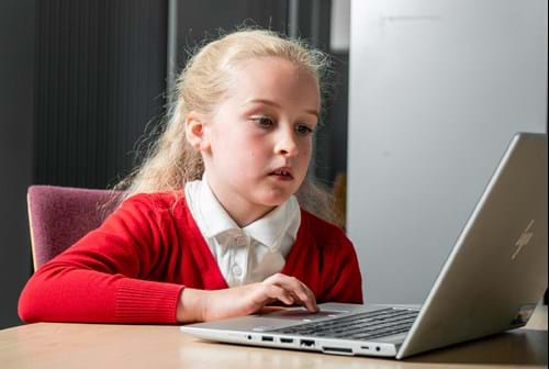 Girl using computer in psychology experiment