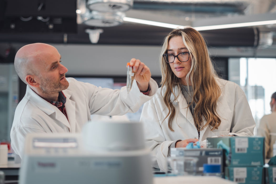 Biomedical sciences student conducting laboratory analysis using specialist diagnostic equipment.
