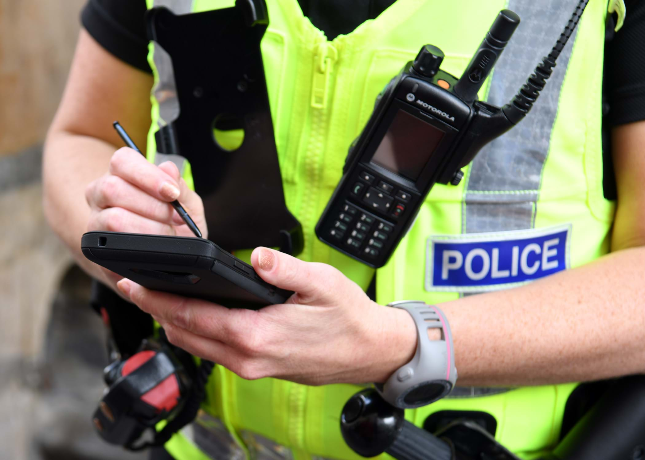 A police officer using a smartphone