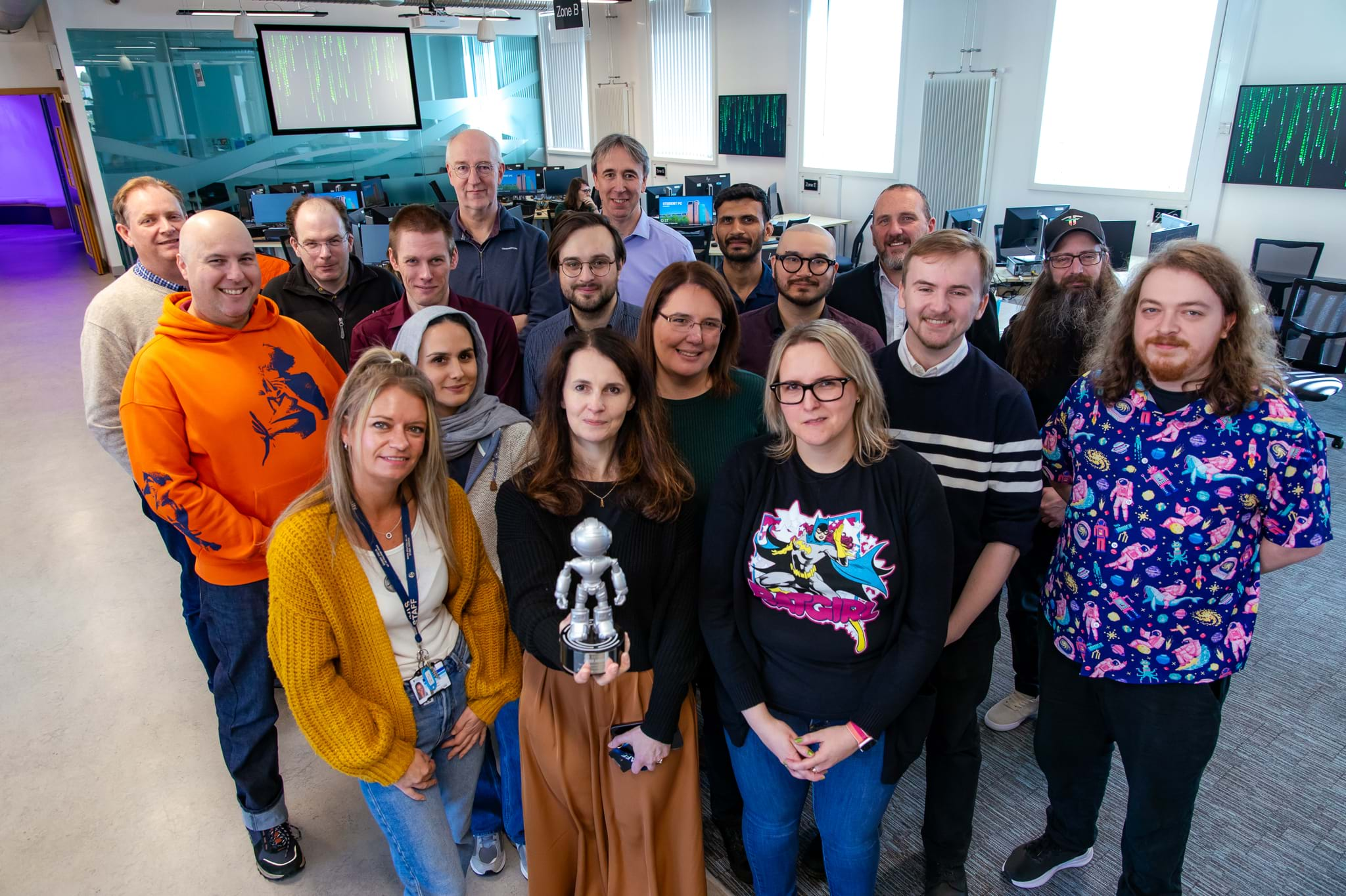 Abertay staff celebrate the Cyber University of the Year win on campus